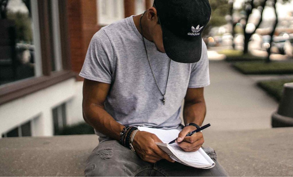 Man writing down